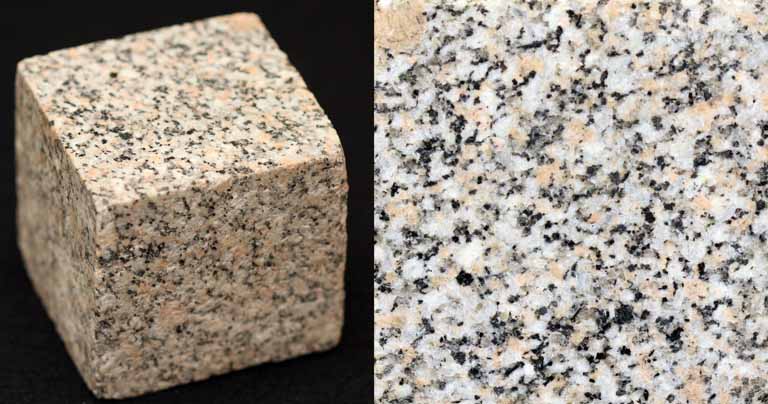 Double colour image of square gray rock block speckled with black, white and gray