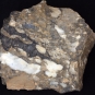 Colour image of brown rock with white spots